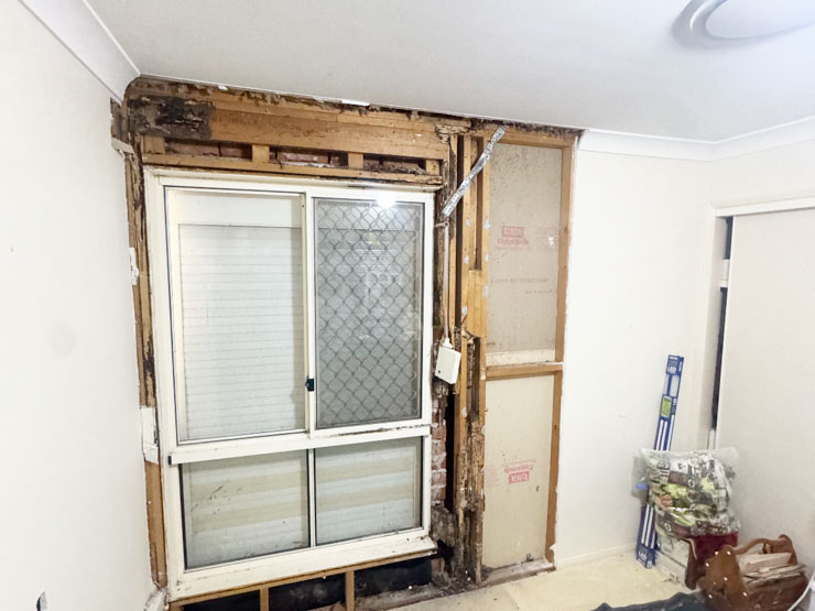 Termite damage to bedroom has been carefully exposed